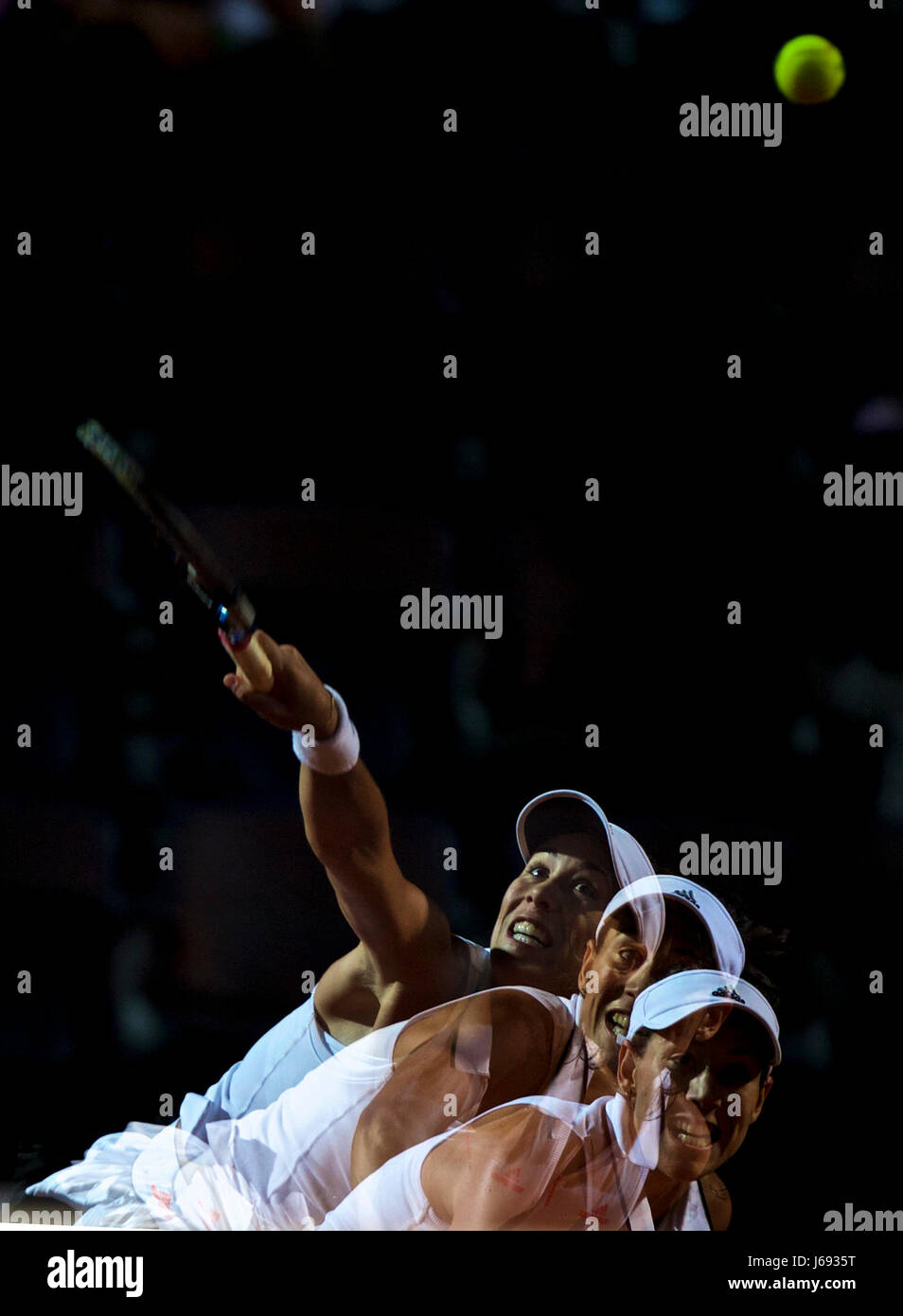 Rome, Italy. 19th May, 2017. This multi-exposure photo shows Garbine Muguruza of Spain serving to Venus Williams of the United States during their quarterfinal match of women's singles at the Italian Open tennis tournament in Rome, Italy, May 19, 2017. Muguruza won 2-1. Credit: Jin Yu/Xinhua/Alamy Live News Stock Photo