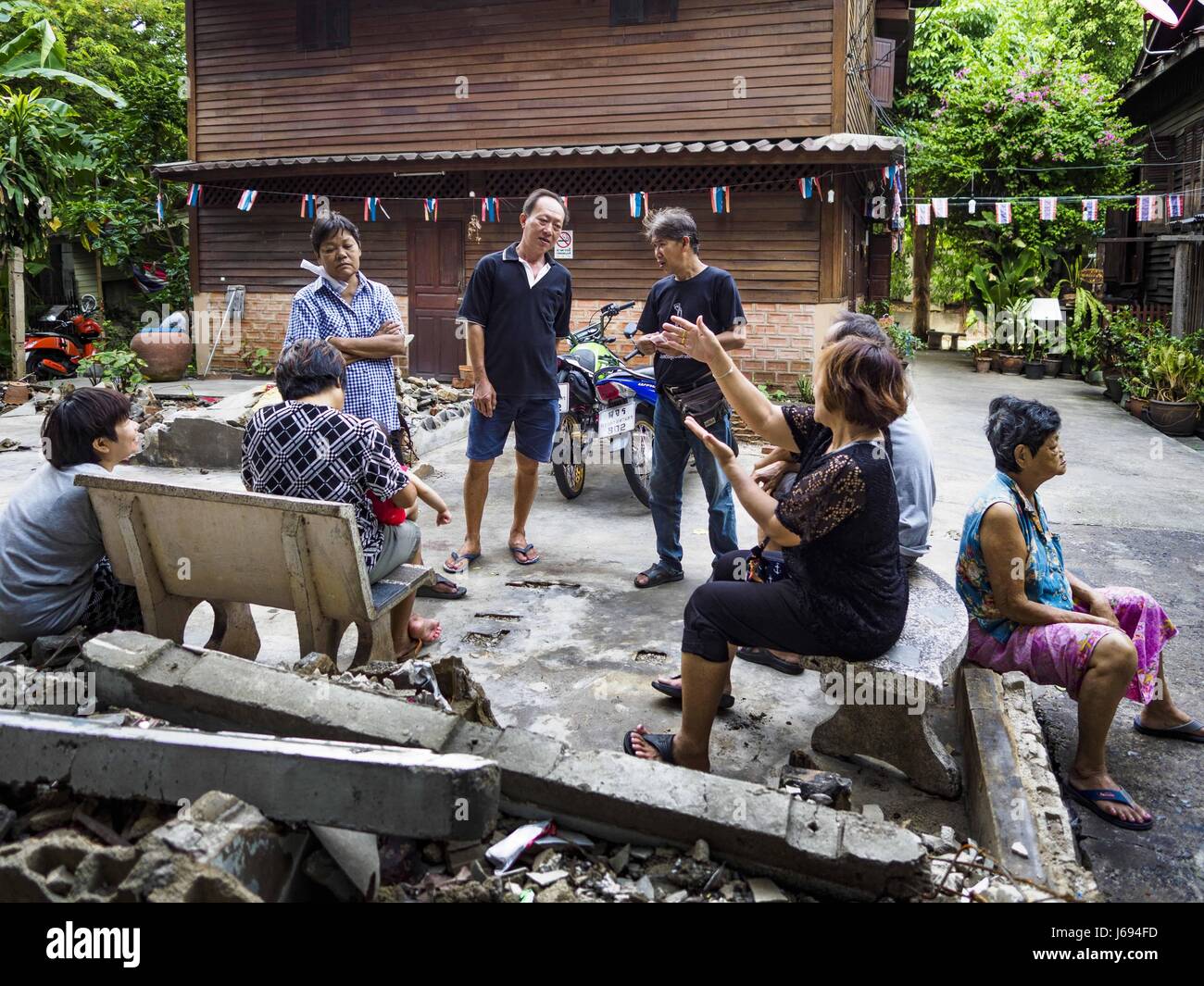 May 16, 2017 - Bangkok, Bangkok, Thailand - Residents of Pom Mahakan gather in an empty lot in the old fort. The lot used to be a family home. The family was evicted by city officials in March, 2017 and the structure torn down. The final evictions of the remaining families in Pom Mahakan, a slum community in a 19th century fort in Bangkok, have started. City officials are moving the residents out of the fort. NGOs and historic preservation organizations protested the city's action but city officials did not relent and started evicting the remaining families in early March. (Credit Image: © Jac Stock Photo