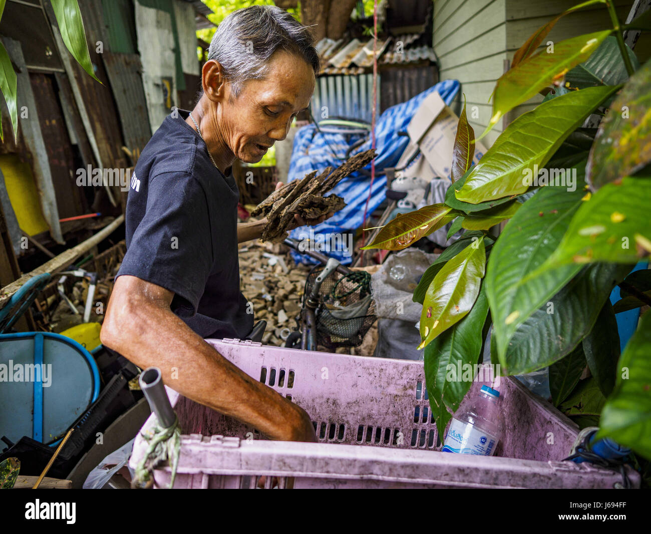 May 20, 2017 - Bangkok, Bangkok, Thailand - A man who will be evicted from Pom Mahakan looks for recyclables on the site of a home that was razed by Bangkok city government officials during a previous eviction in the fort. The final evictions of the remaining families in Pom Mahakan, a slum community in a 19th century fort in Bangkok, have started. City officials are moving the residents out of the fort. NGOs and historic preservation organizations protested the city's action but city officials did not relent and started evicting the remaining families in early March. (Credit Image: © Jack Kur Stock Photo