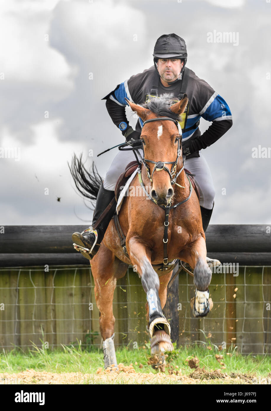 Rockingham Castle grounds, Corby, England. Saturday 20th May 2017. An unnamed spanish rider and his horse leap an obstacle in the cross country phase of the Rockingham International Horse Trials on Saturday 20th May 2017 in the grounds of the norman Rockingham castle at Corby, England. Credit: miscellany/Alamy Live News Stock Photo