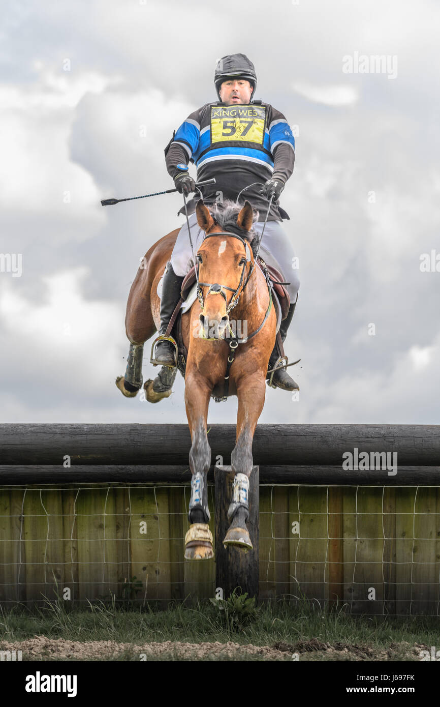 Rockingham Castle grounds, Corby, England. Saturday 20th May 2017. An unnamed spanish rider and his horse leap an obstacle in the cross country phase of the Rockingham International Horse Trials on Saturday 20th May 2017 in the grounds of the norman Rockingham castle at Corby, England. Credit: miscellany/Alamy Live News Stock Photo