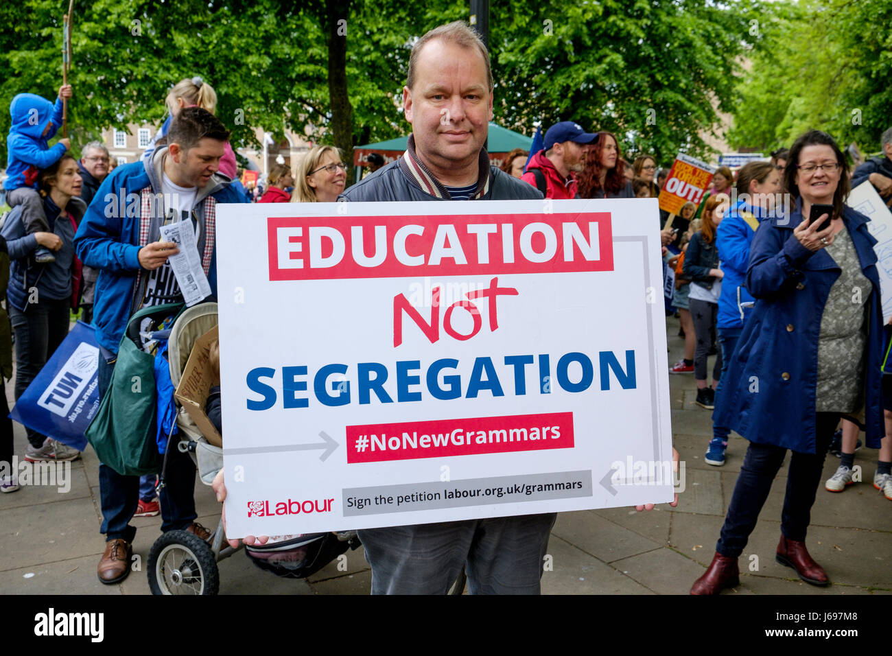 Bristol,UK. 20th May, 2017. Protesters carrying signs and placards are pictured as they march through the streets of Bristol to protest about education cuts,the march was organised by the South West Region of the NUT in response to the huge assault on school funding. Credit: lynchpics/Alamy Live News Stock Photo