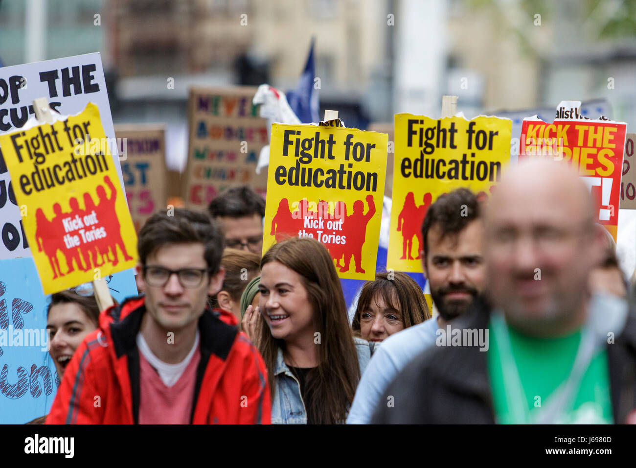 Bristol,UK. 20th May, 2017. Protesters carrying signs and placards are pictured as they march through the streets of Bristol to protest about education cuts,the march was organised by the South West Region of the NUT in response to the huge assault on school funding. Stock Photo