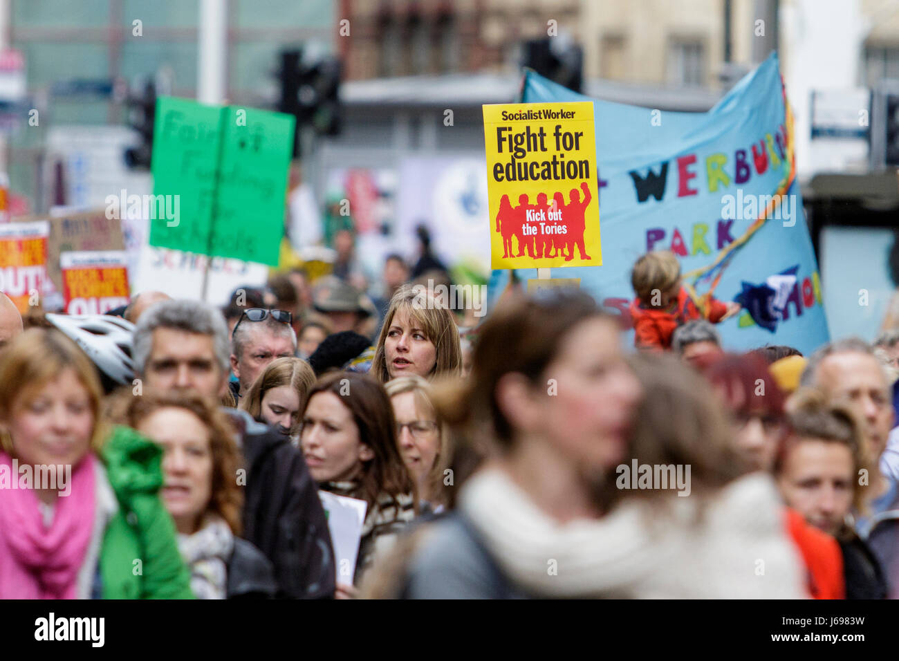 Bristol,UK. 20th May, 2017. Protesters carrying signs and placards are pictured as they march through the streets of Bristol to protest about education cuts,the march was organised by the South West Region of the NUT in response to the huge assault on school funding. Stock Photo