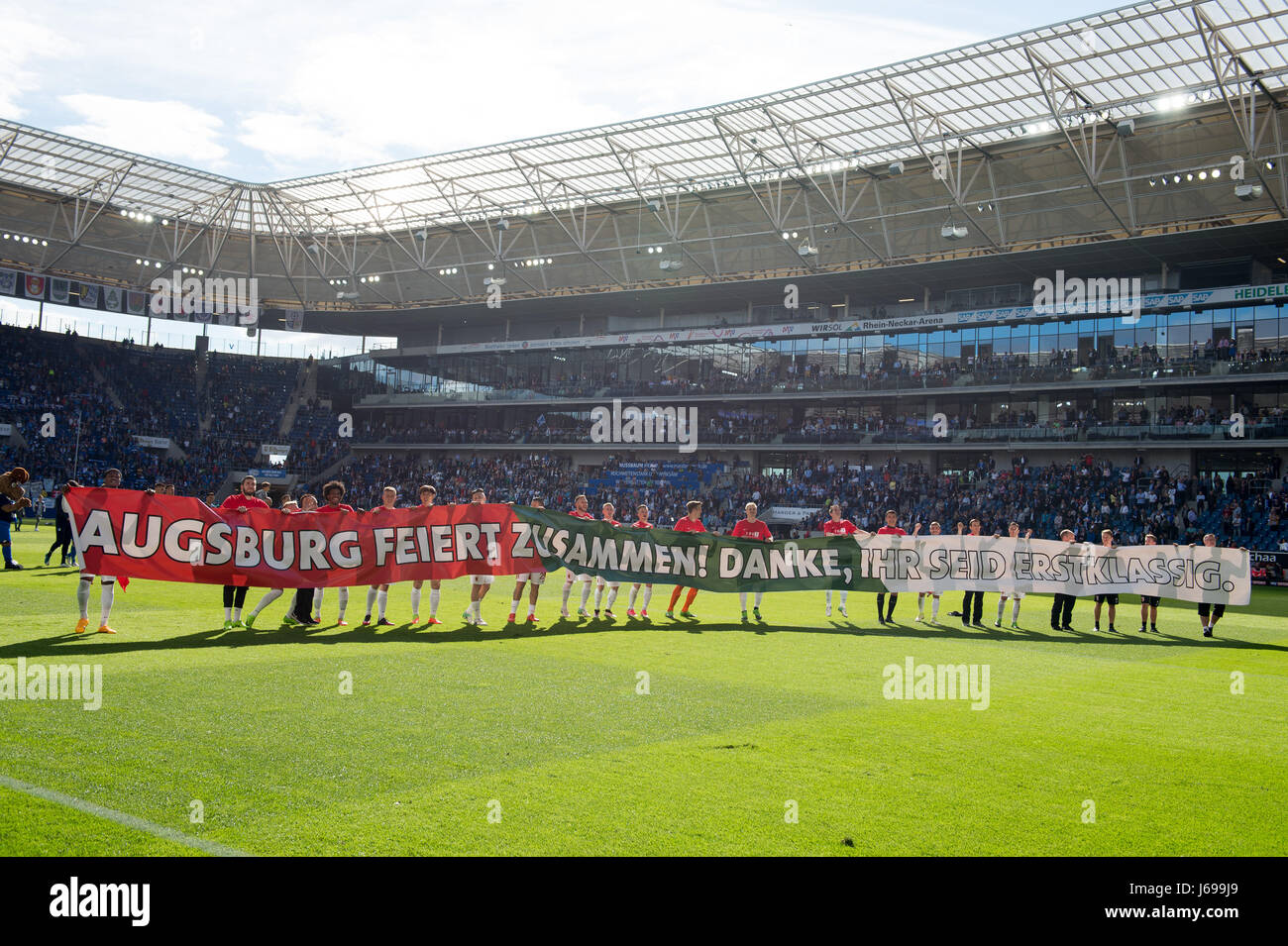 FC Augsburg's team thanks the fans with a banner 'Augsburg feiert zusammen! Danke, ihr seid erstklassig' (lit. Augsburg celebrates together! Thank you, you are first-class)after the German Bundesliga soccer match between 1899 Hoffenheim and FC Augsburg in the Wirsol Rhein-Neckar-Arena in Sinsheim, Germany, 20 May 2017. The German Bundesliga soccer match between 1899 Hoffenheim and FC Augsburg ended in a tie (0-0). (EMBARGO CONDITIONS - ATTENTION: Due to the accreditation guidelines, the DFL only permits the publication and utilisation of up to 15 pictures per match on the internet and in on Stock Photo