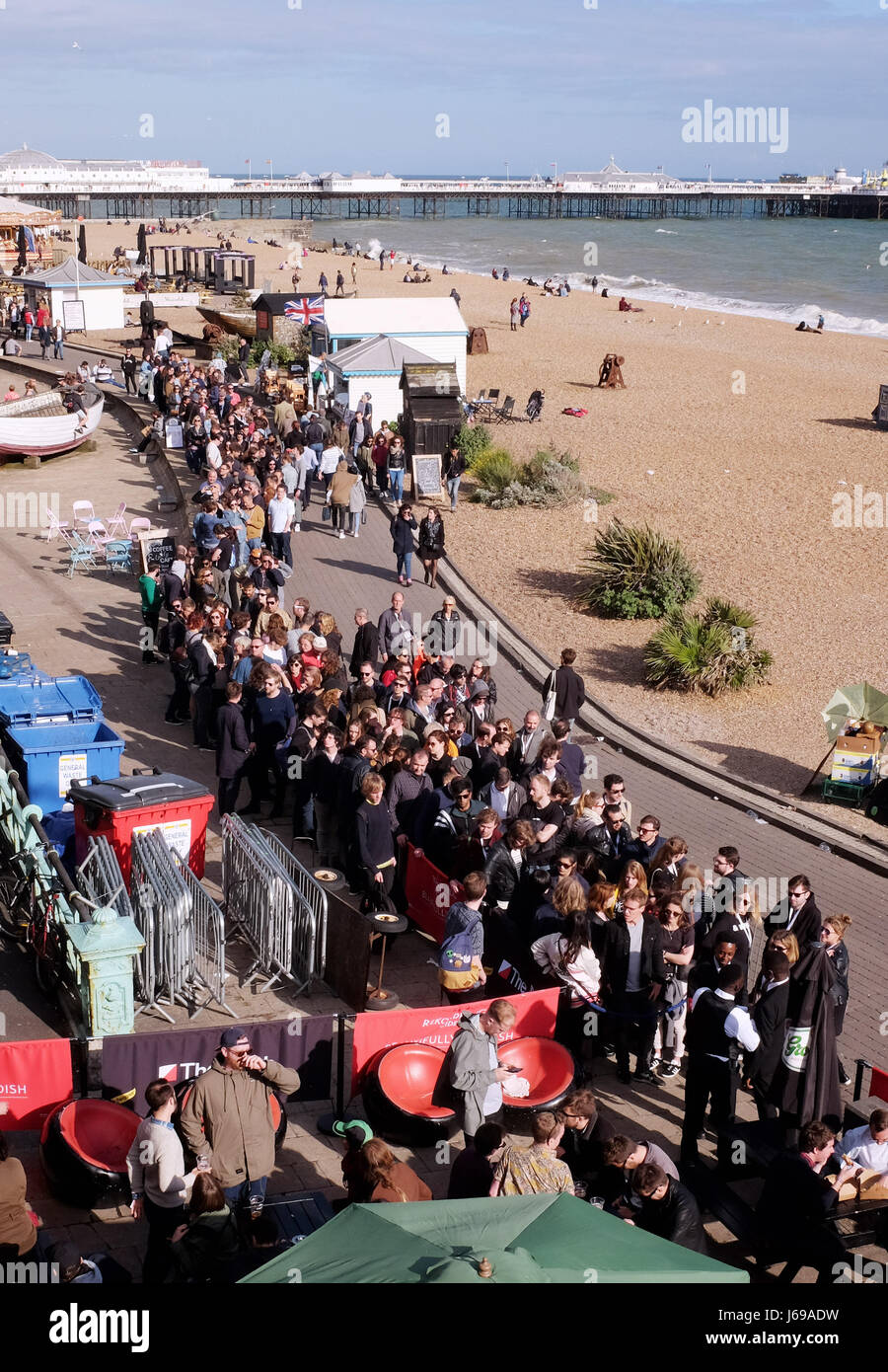 Brighton, UK. 20th May, 2017. Crowds queue for one of the Great Escape  music festival venues on the seafront as they enjoy the late afternoon  sunshine in Brighton with the forecast set