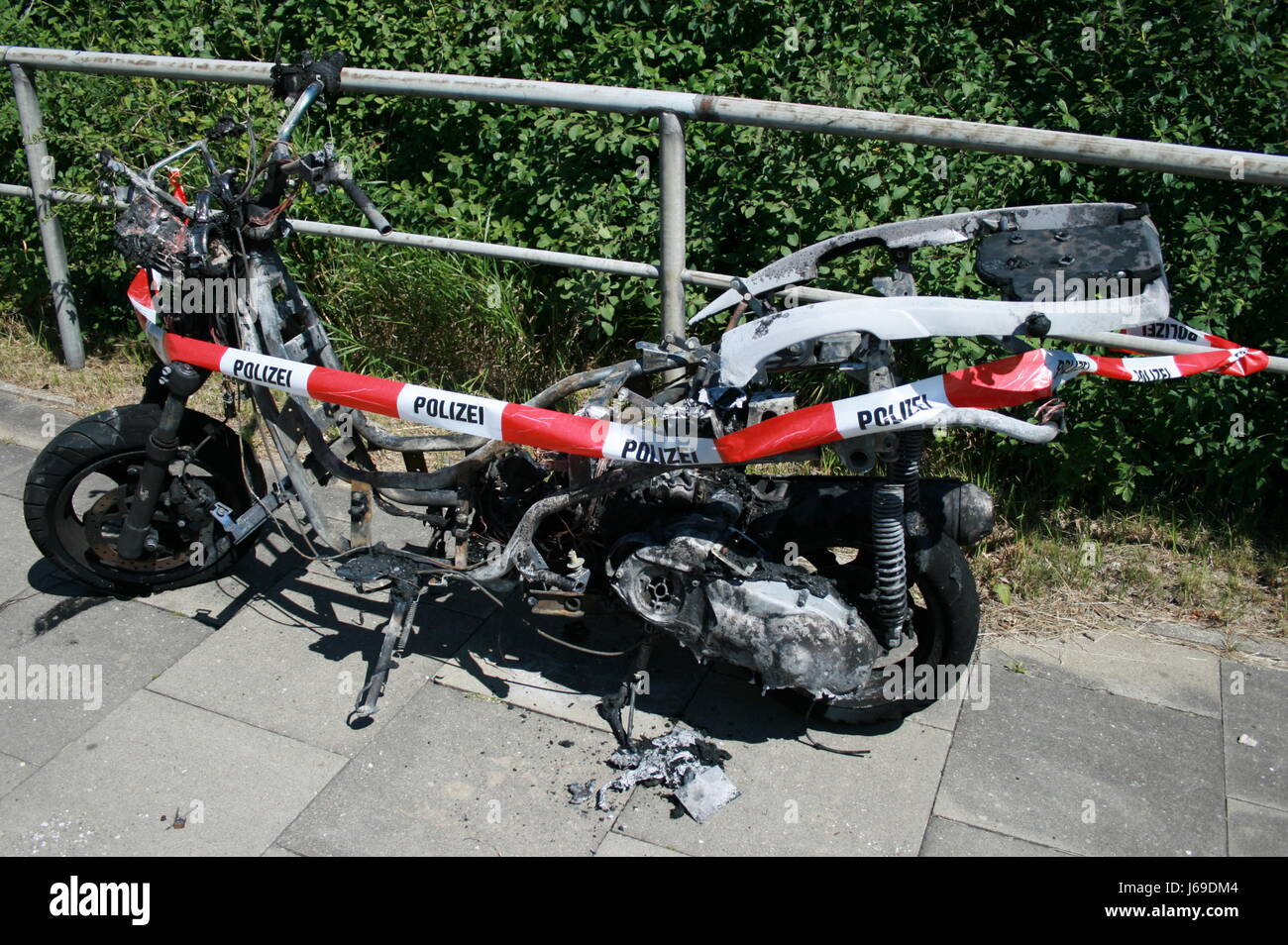 scooter roller scooter barrier wreck roller warning burnt burned tape police Stock Photo