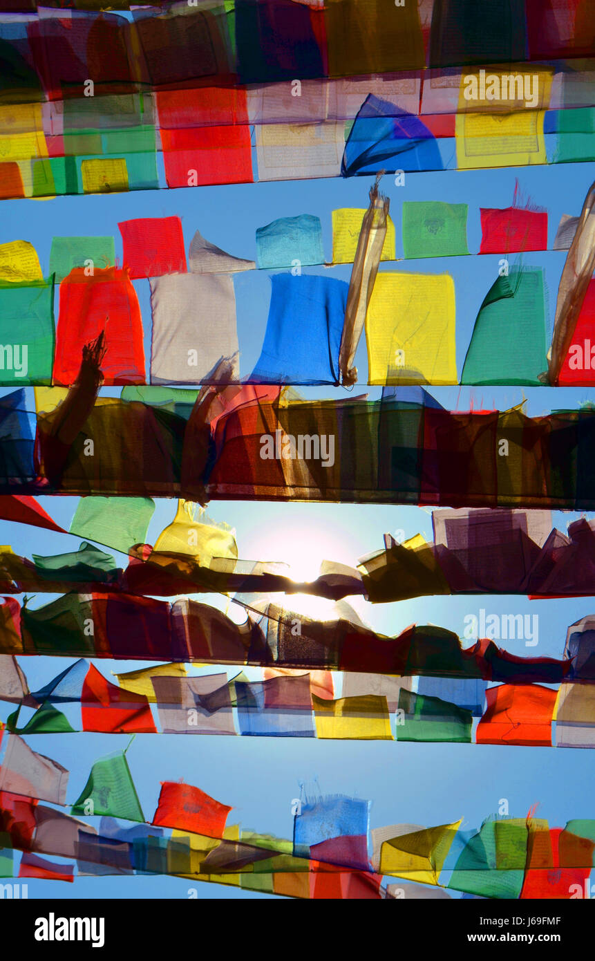 Colorful Buddhism prayer flags lungta and sun in Svayambunatkh temple. Stock Photo