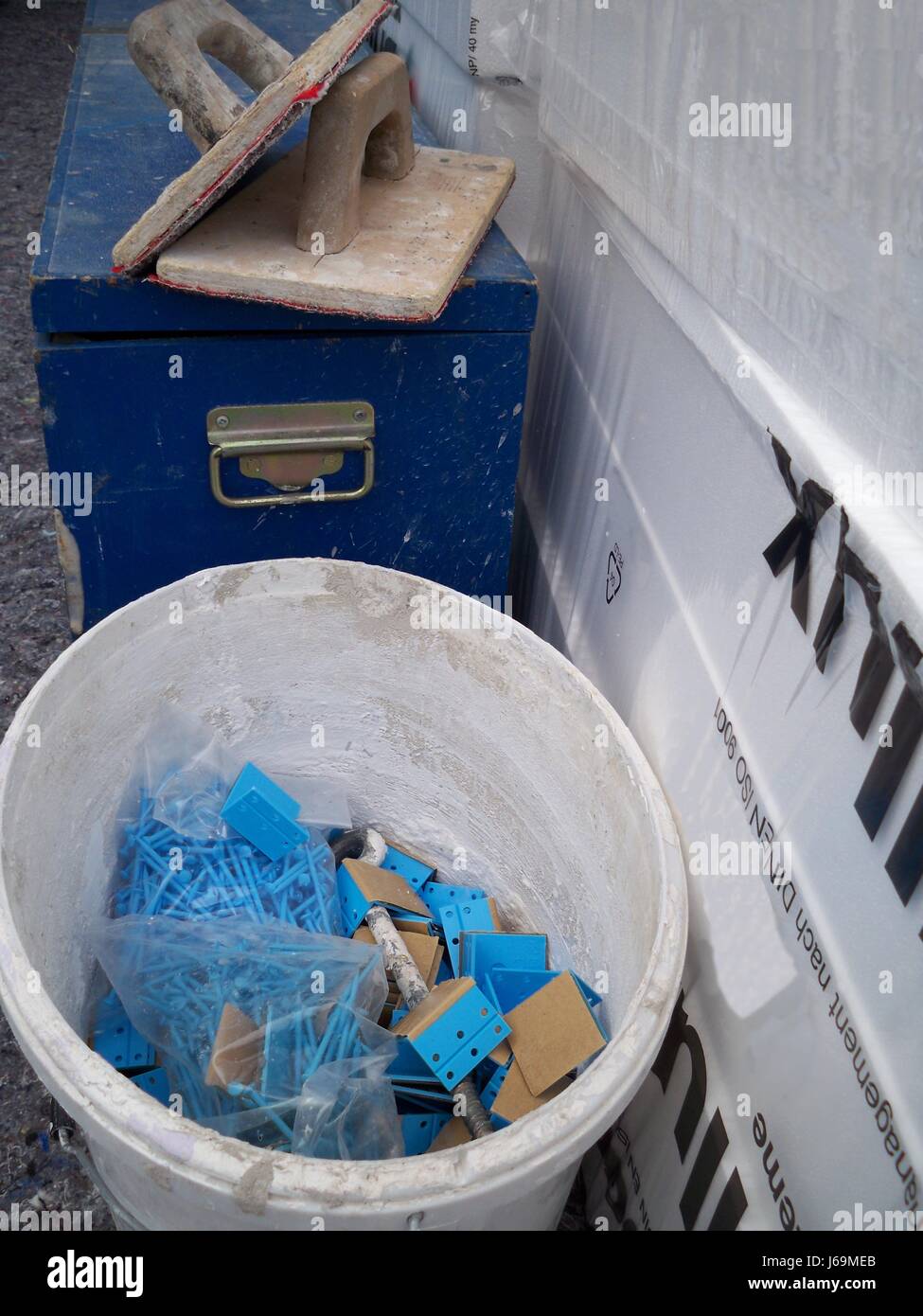 bucket redevelopment nail angle polystyrene insulation nails blue house Stock Photo