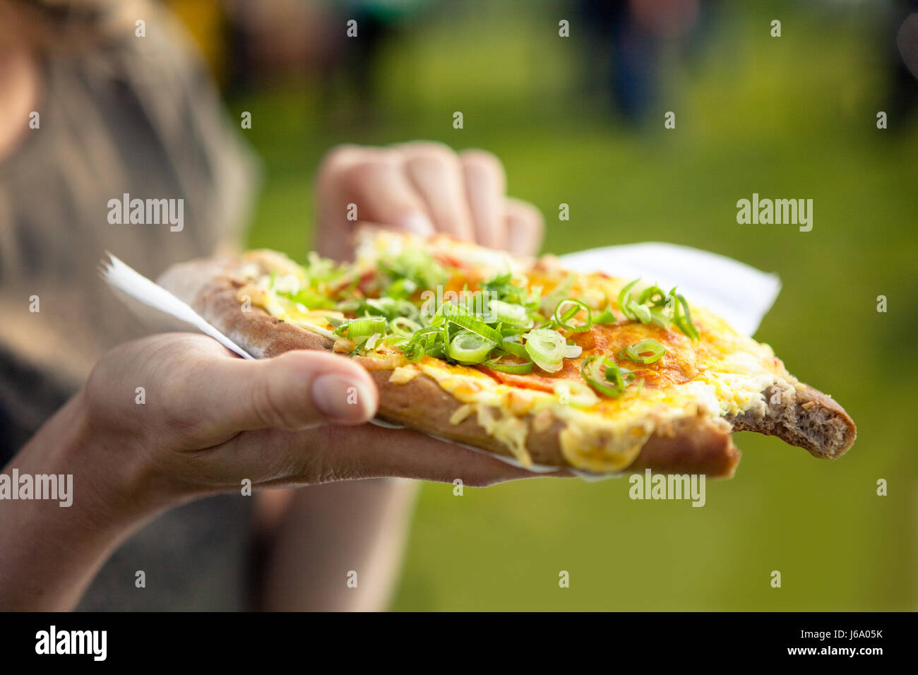 bread hand hot dainty pizza bite off hand green hunger taste hungry vegetable Stock Photo