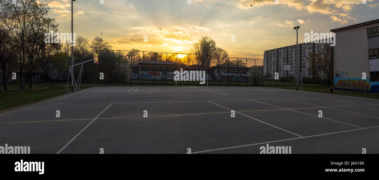 Sunrise over a basketball court Stock Photo Alamy