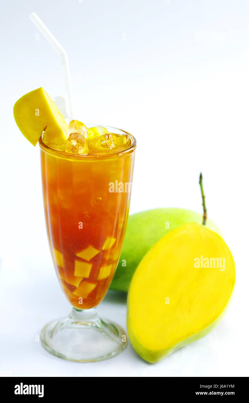 Glass of fresh mango tea on white background Stock Photo - Alamy