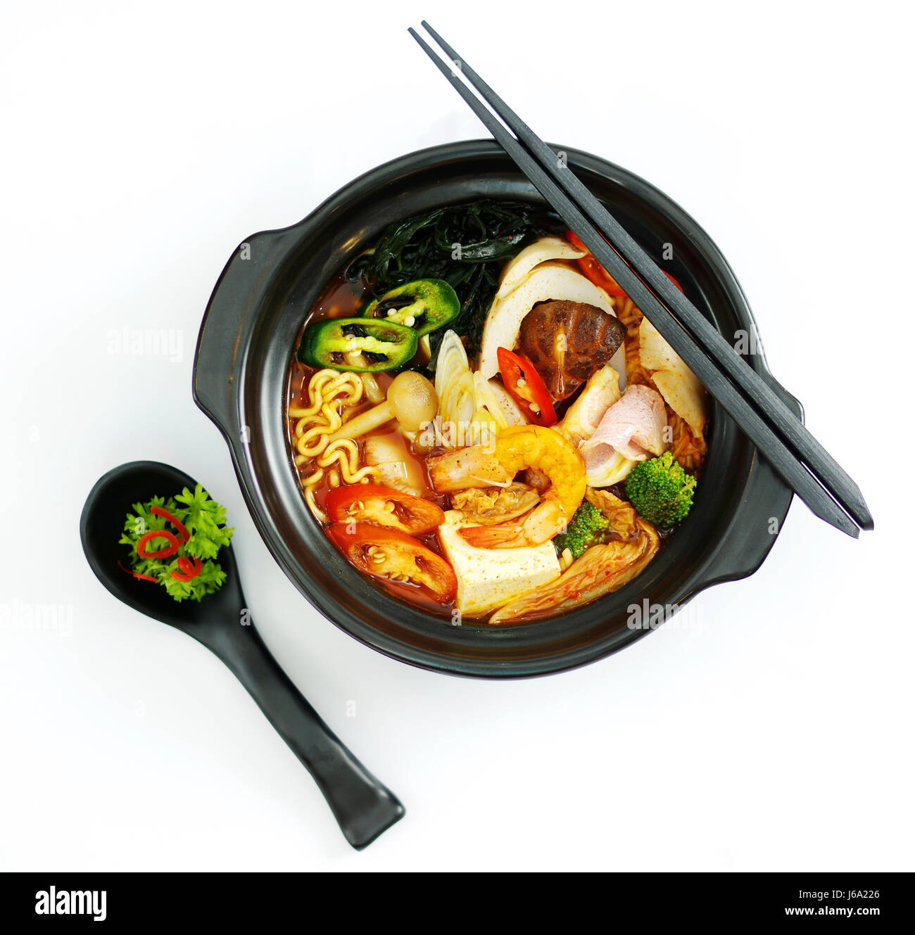 Hot chili ramen noodle with seafood in black stew Stock Photo Alamy