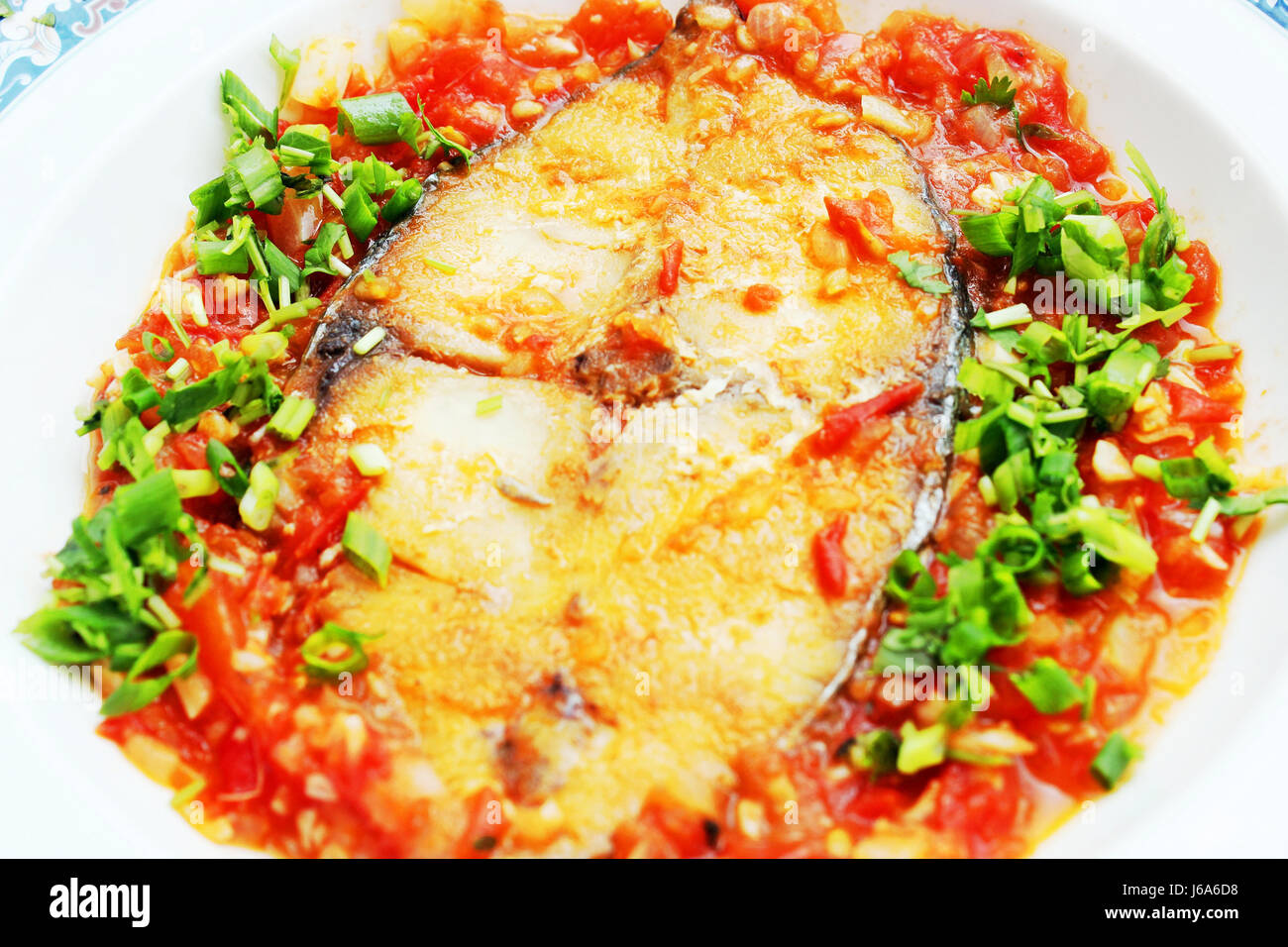 Mackerel braised with tomato sauce and onion Stock Photo Alamy