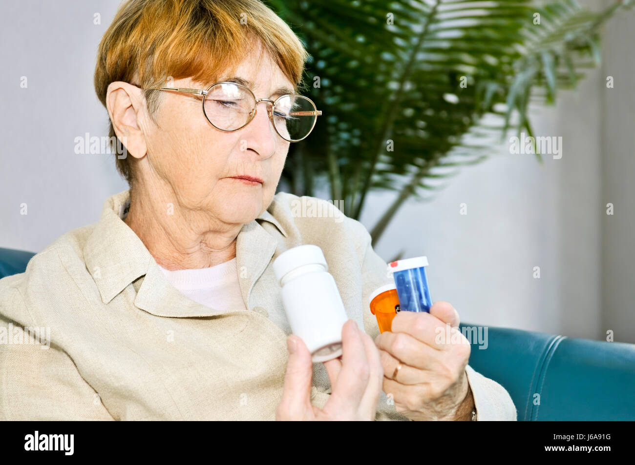 woman pills drugs elderly healthcare senior senior citizen elderly person elder Stock Photo