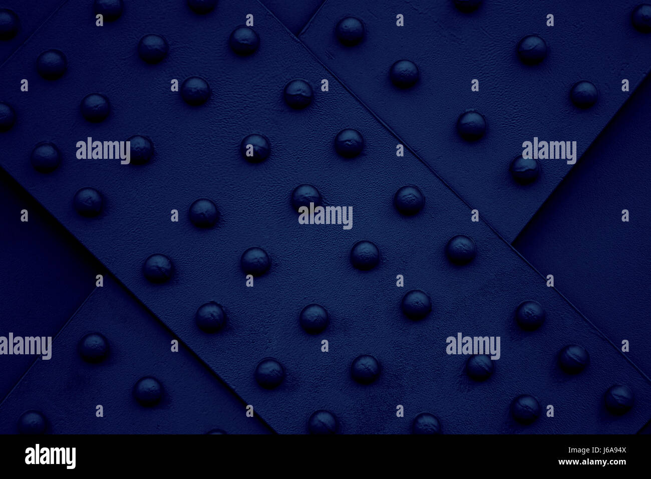 iron steel metal rivet dark blue backdrop background industry cold high ...