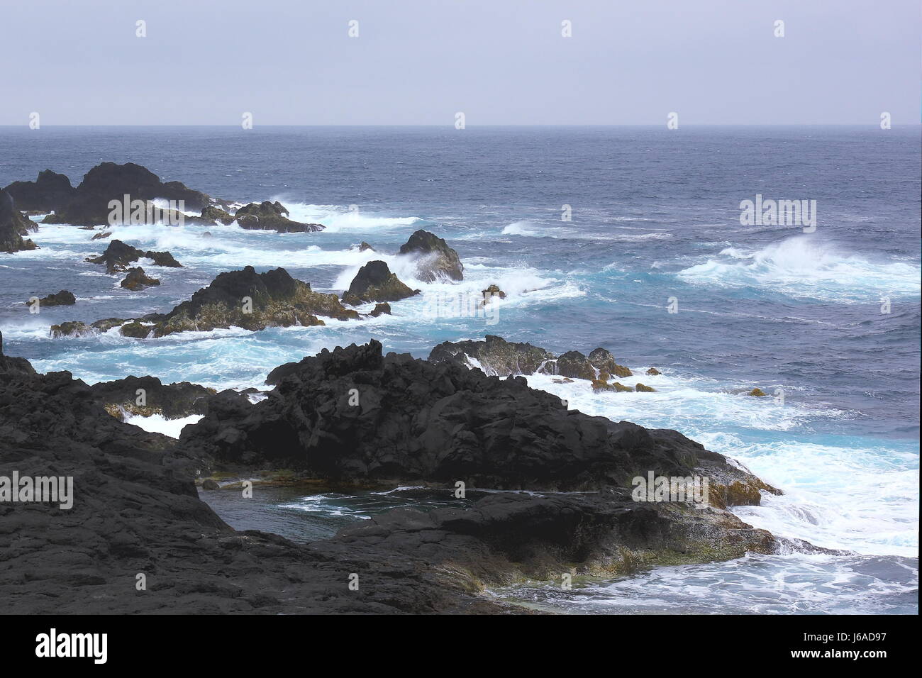 waves rock atlantic ocean salt water sea ocean water portugal spray azores Stock Photo