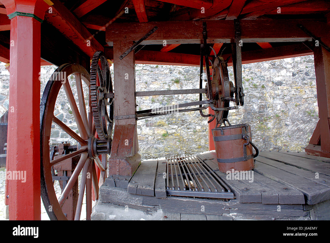 historical wheel cogwheel fountain winch draw well historical wheel beam bucket Stock Photo