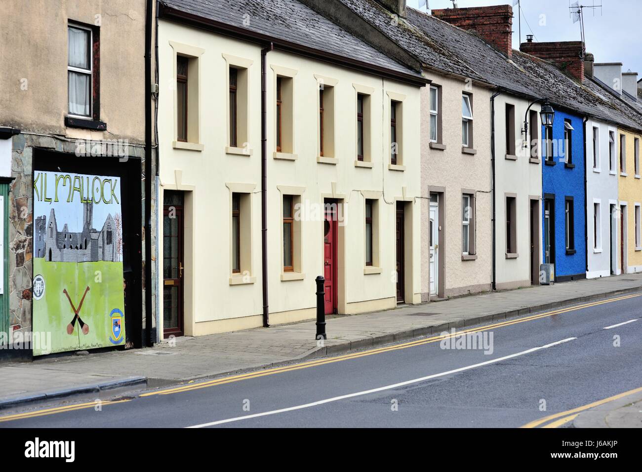 Color provides variety for a block of residences on Sarsfield Street in the town of Kilmallock, County Limerick, Ireland. Stock Photo