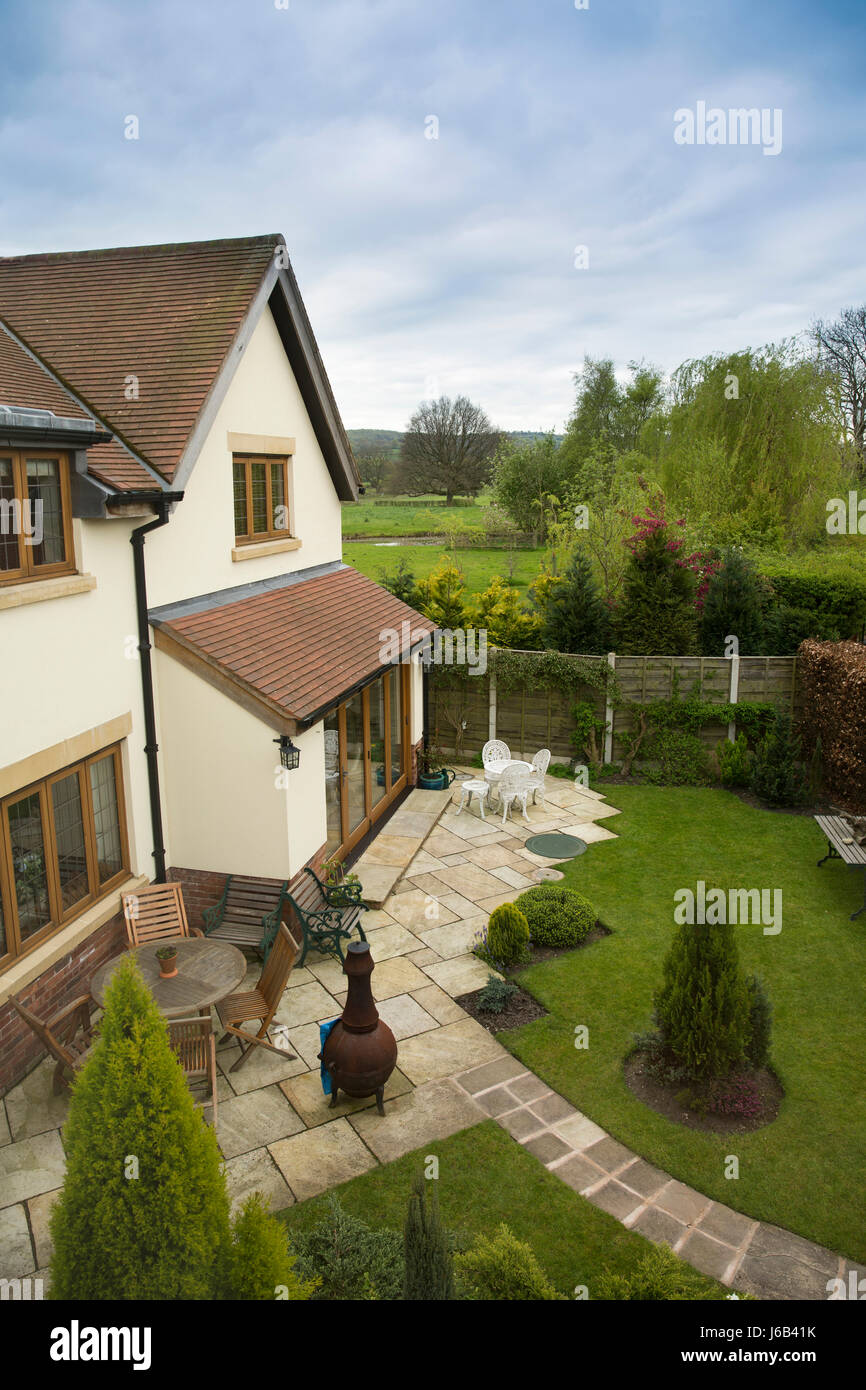 UK, England, Cheshire, Congleton, back garden of newly built house beside green belt countryside Stock Photo