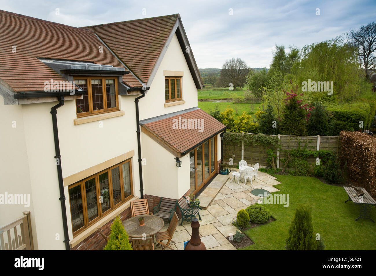 UK, England, Cheshire, Congleton, back garden of newly built house beside green belt countryside Stock Photo