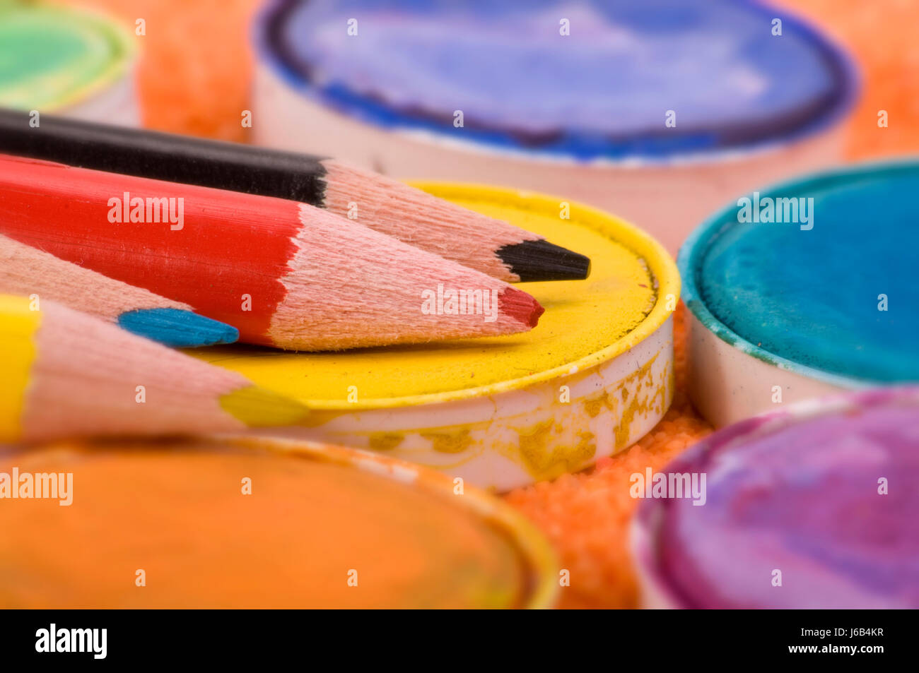crayons and paint pots Stock Photo