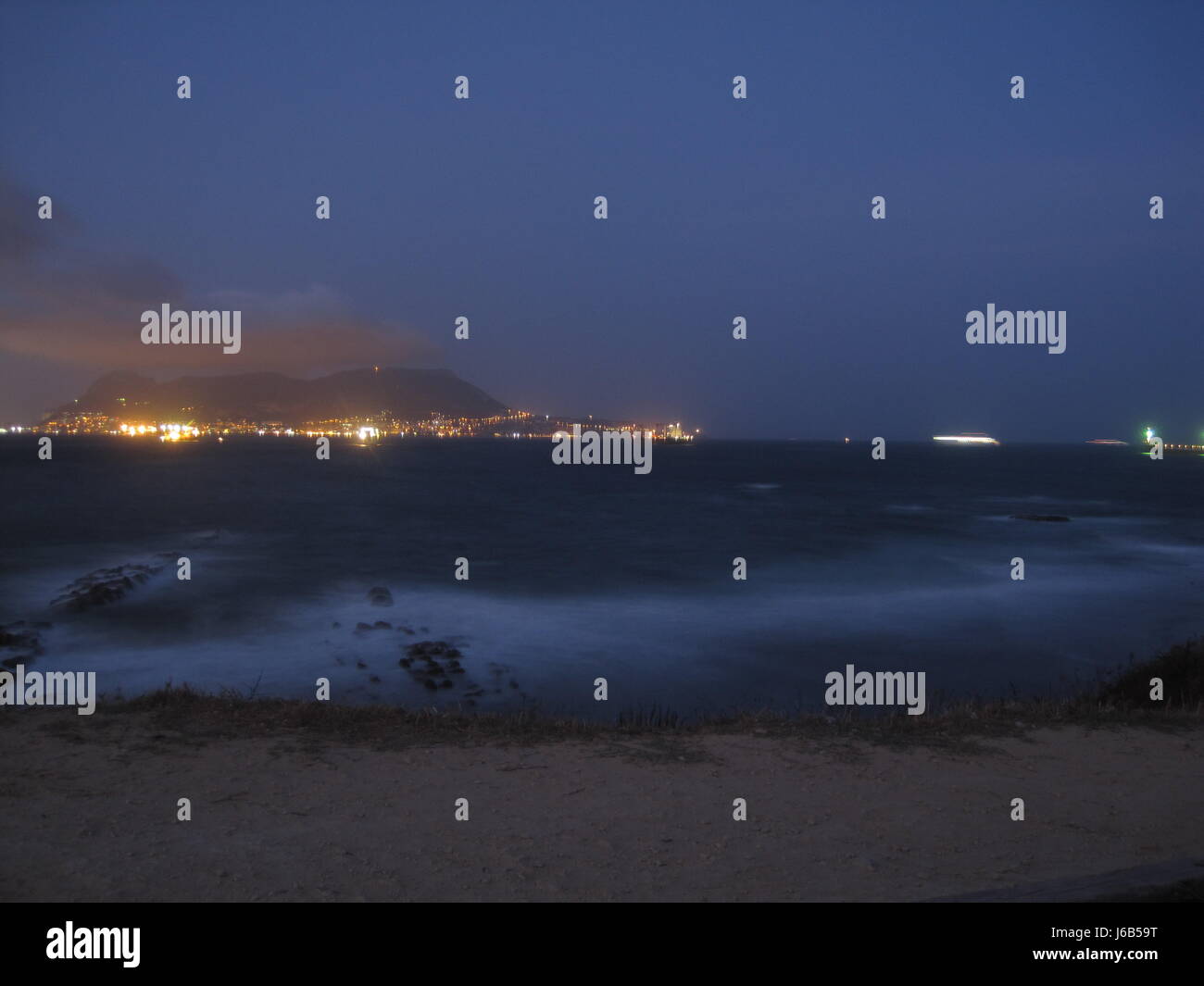 coast gibraltar salt water sea ocean water night nighttime night photograph Stock Photo Alamy
