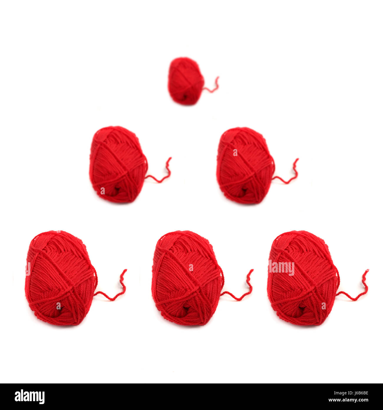 wool thread knit threads unrolled ball of wool tissue red macro close ...