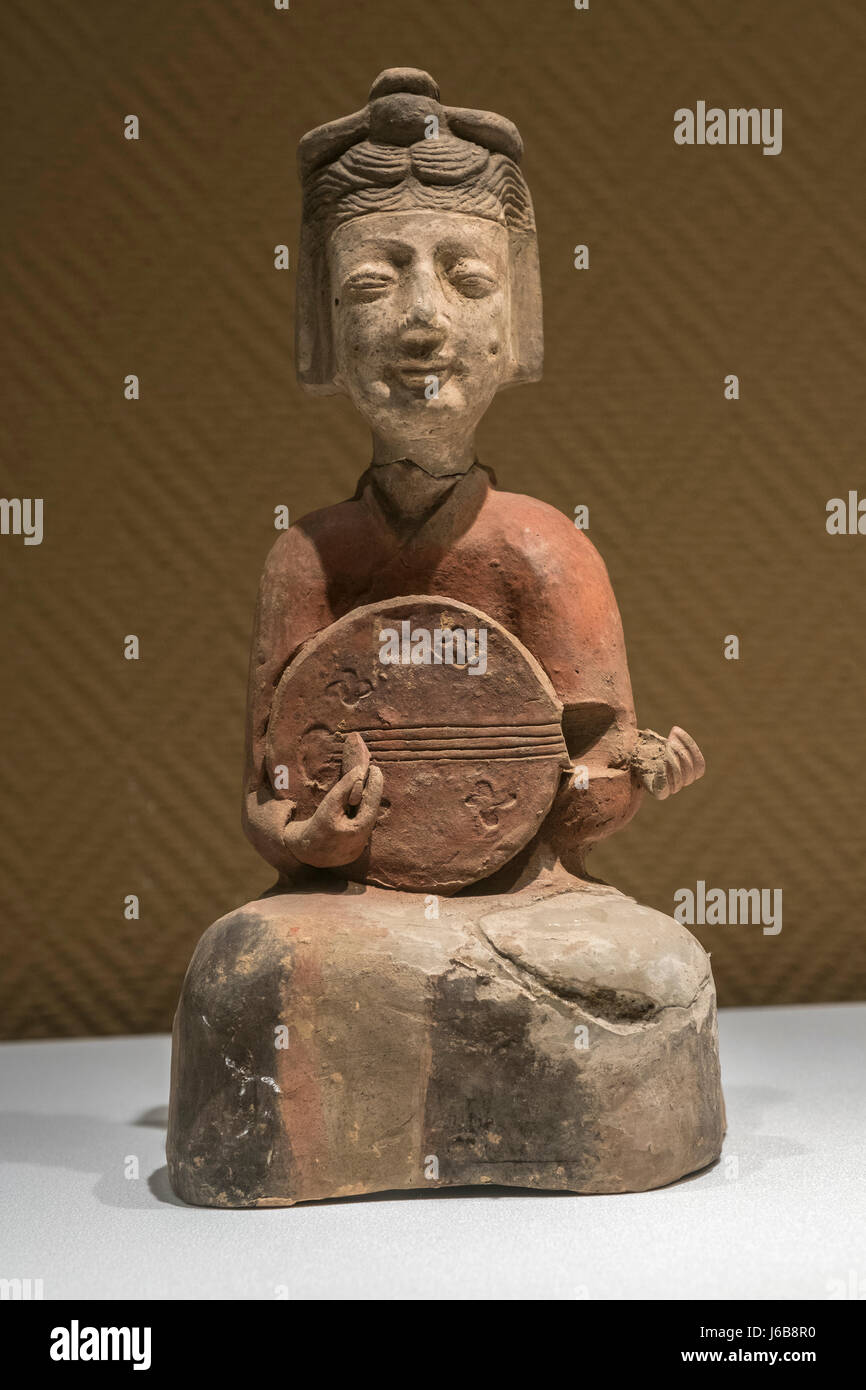 Musician pottery figurine Three Kingdoms Period  Sixteen Kingdoms Period (22-  439) The archaeology institute of Xian. Stock Photo