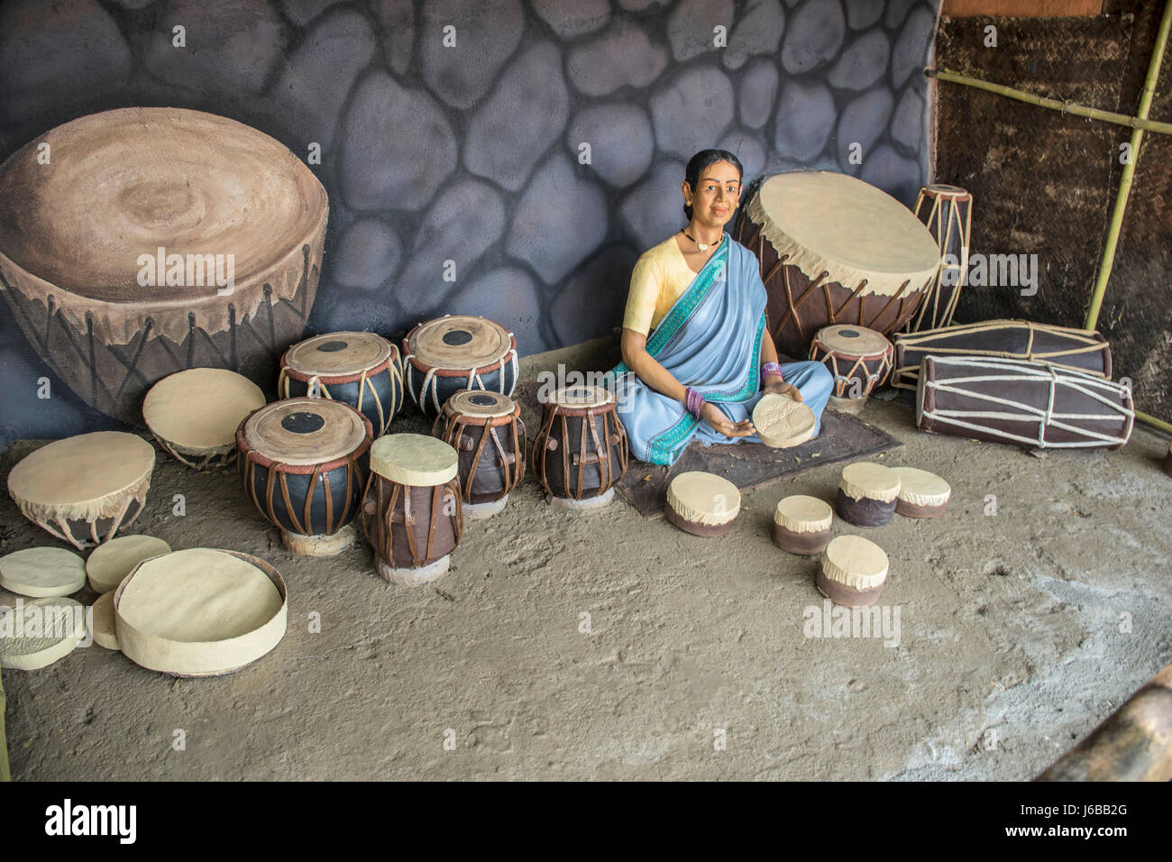 Woman selling musical instruments, sculpture museum, Kaneri Math, Kolhapur, Maharashtra Stock Photo