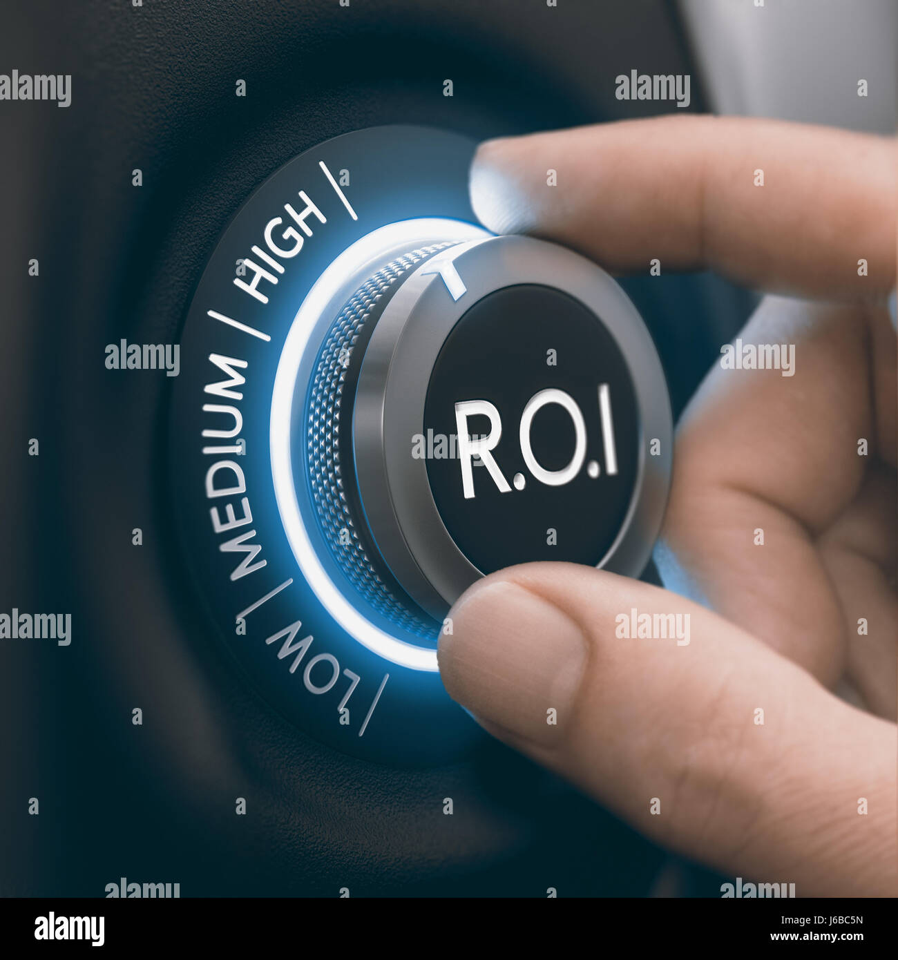 Hand turning knob to select high return on investment, black and blue tones. ROI Concept. Composite image between a hand photography and a 3D backgrou Stock Photo