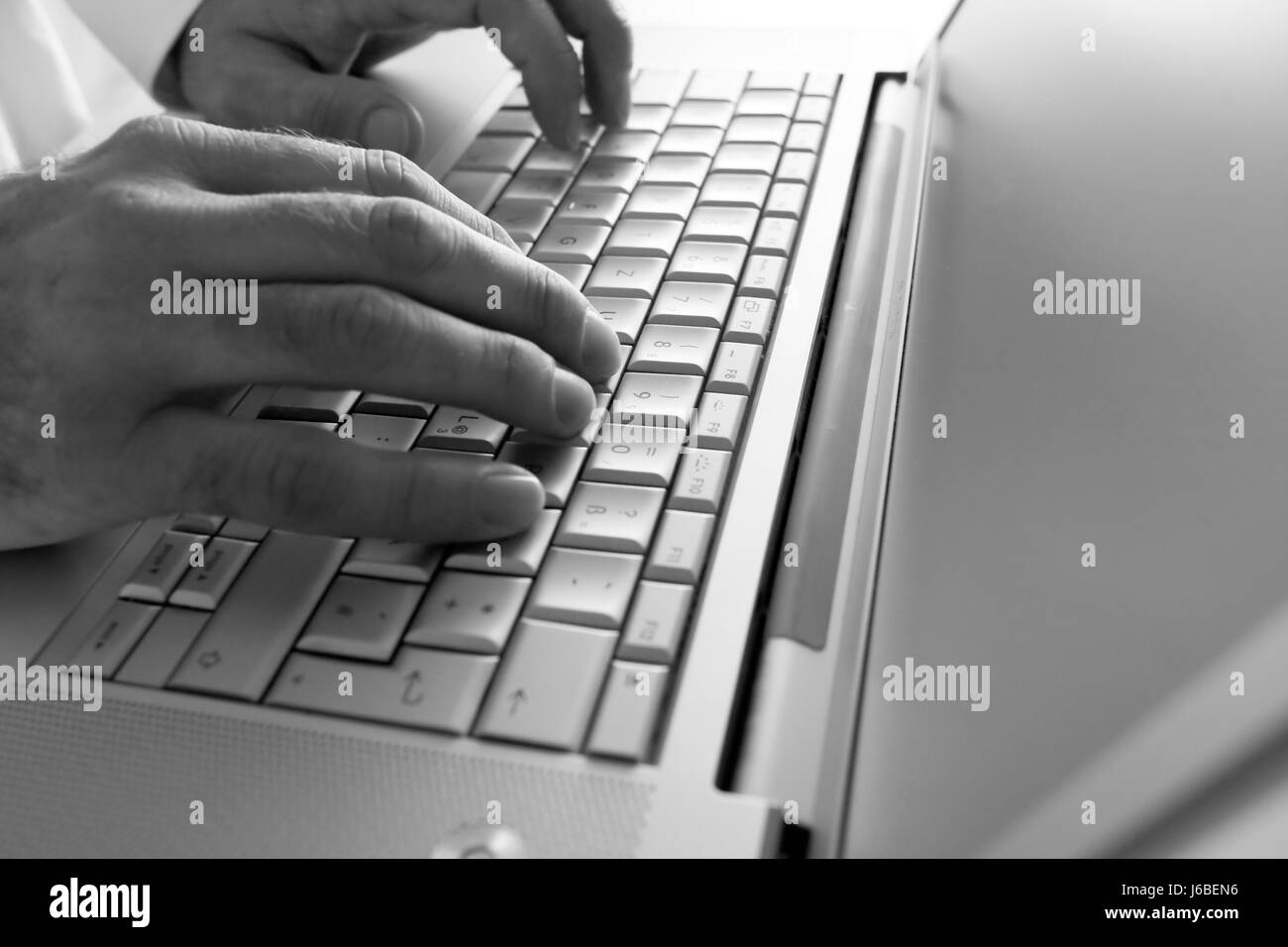 silver colored laptop Stock Photo