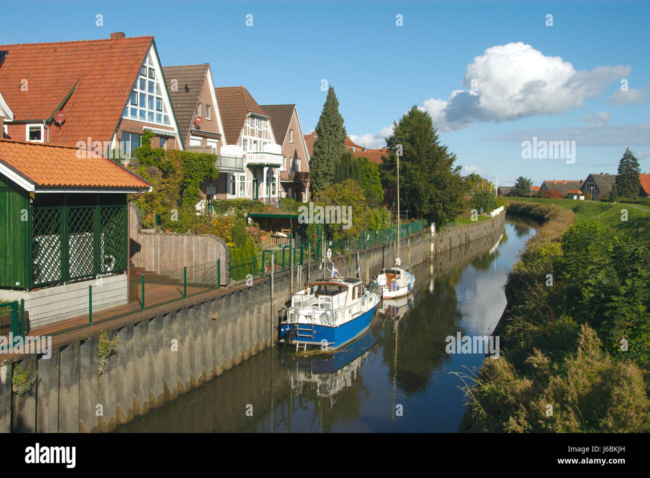 waters hamburg Northern Germany dike land realty ground old houses city town Stock Photo