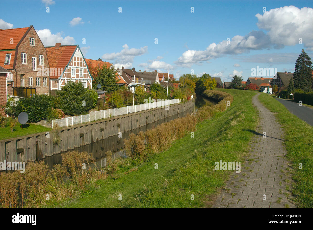 waters hamburg Northern Germany dike land realty ground old houses city town Stock Photo