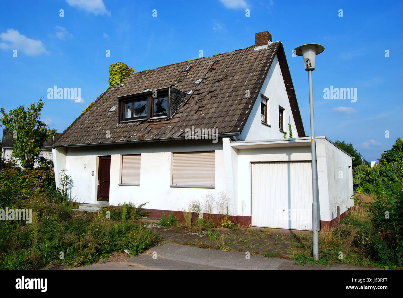 house building window porthole dormer window pane destruction damage damages Stock Photo