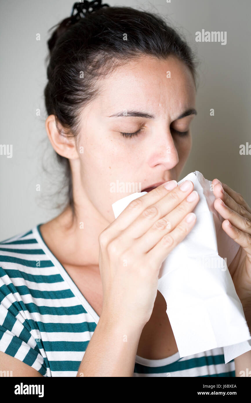 woman cold catarrh ache handkerchief sneeze sneezing flu young younger coughing Stock Photo Alamy