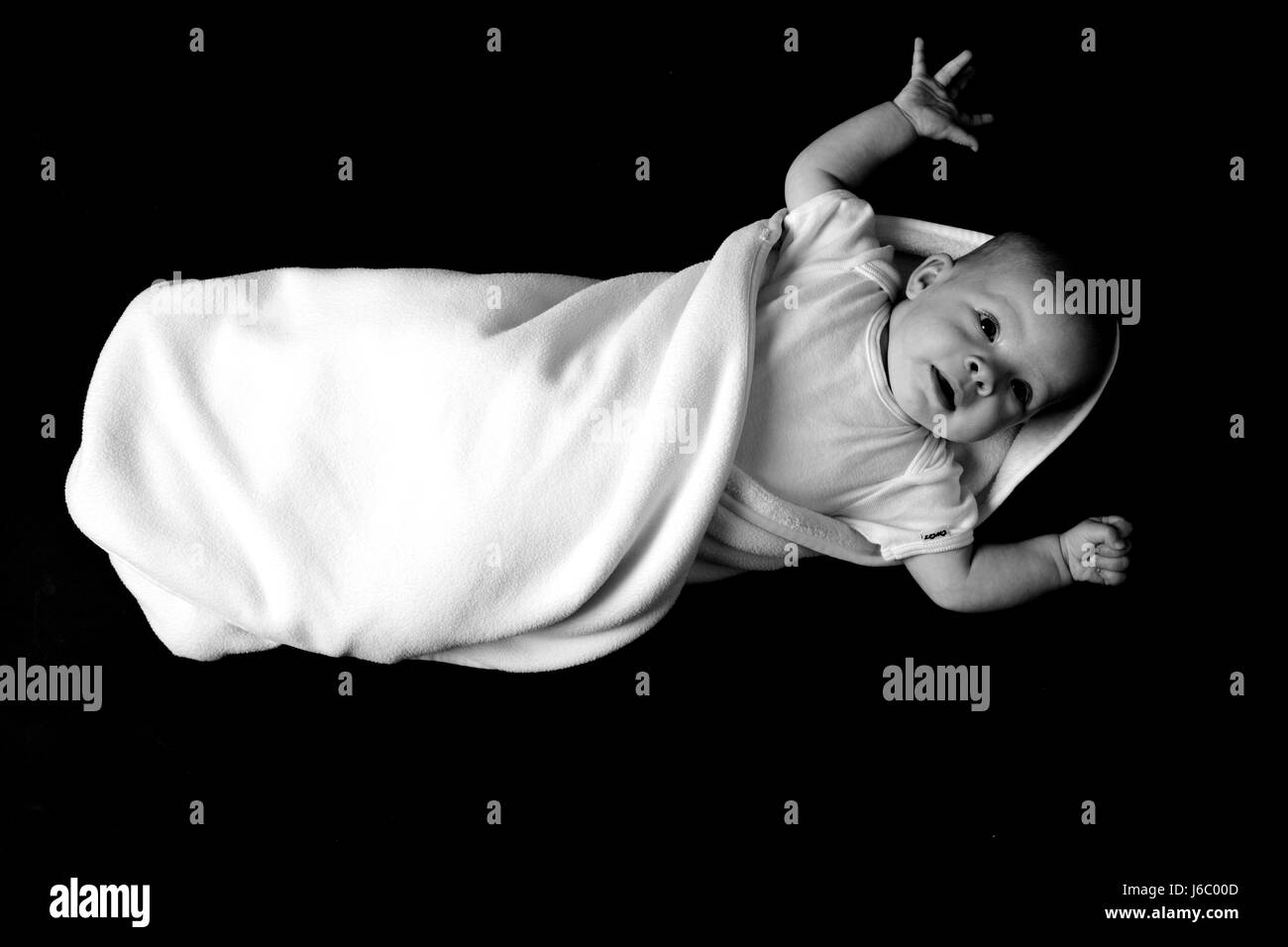 baby wrapped in blanket Stock Photo Alamy