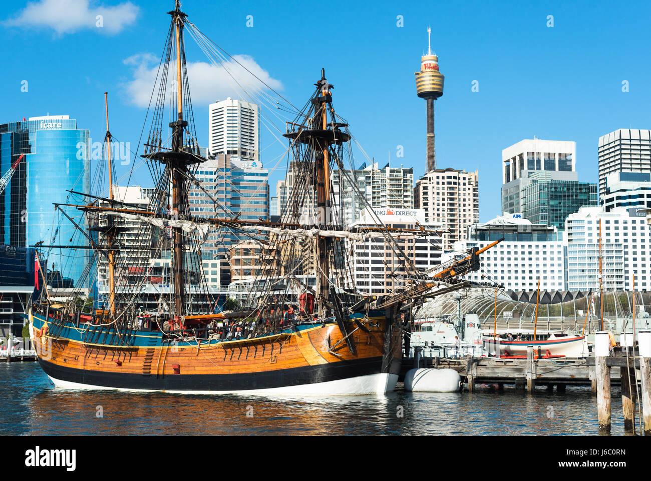 A replica of James Cook's HMS Endeavour, moored alongside the Australian National Maritime Museum in Darling Harbour, Sydney. Stock Photo