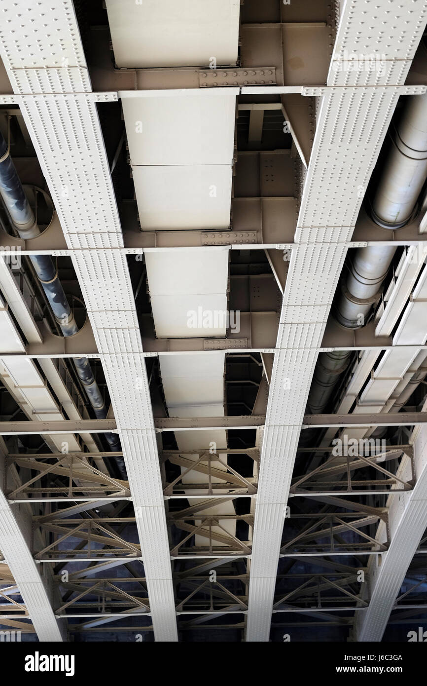 Metal structures of bridge, view from underneath, shapes, lines Stock Photo