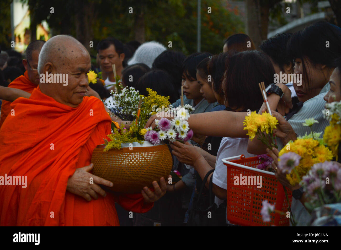 Chiang Rai, Thailand : December 29, 2016. Floral Offerings Festival 1st time of traditional merit making ceremony.Phradhammarajanuwatra receive flower Stock Photo