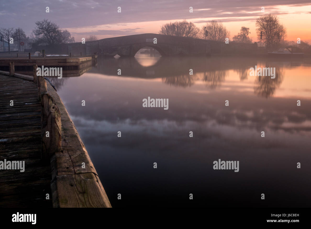 The historic bridge at Potter Heigham on a misty winters morning Stock