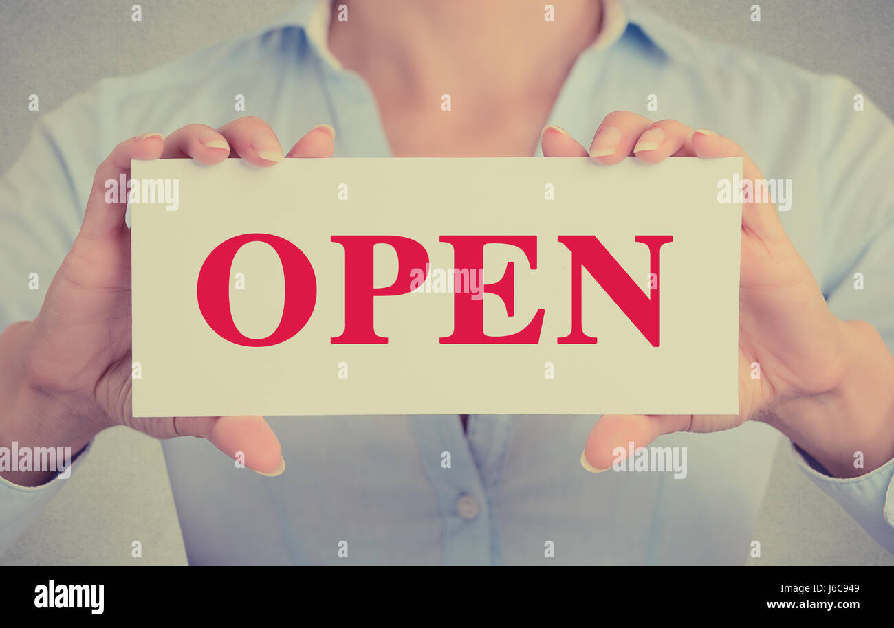 Closeup businesswoman hands holding white card sign with open text ...