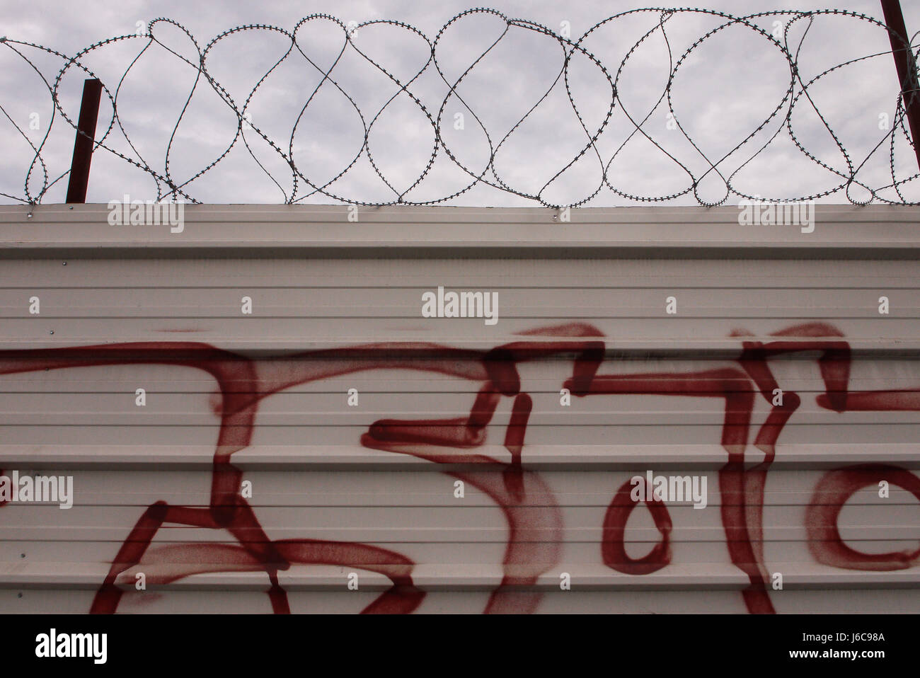 Tags and barbed wire on a palisade Stock Photo - Alamy