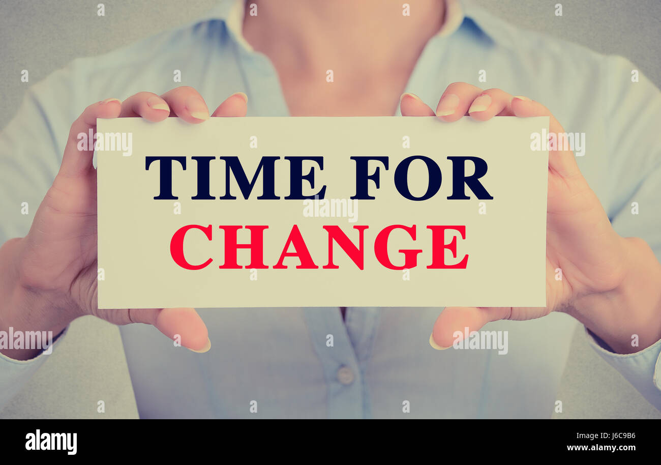 Businesswoman hands holding white card sign with time for change text ...