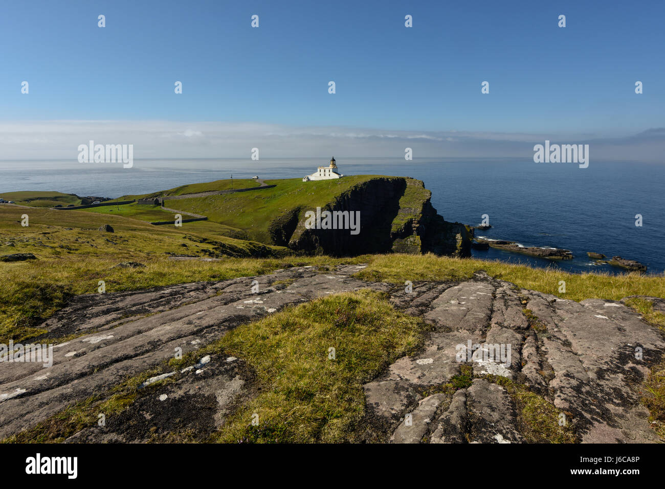 Lighthouse on rugged cliffs with gorgeous blue sky in the background. Point of Stoer, Assynt, Highlands, Scotland, Great Britain Stock Photo