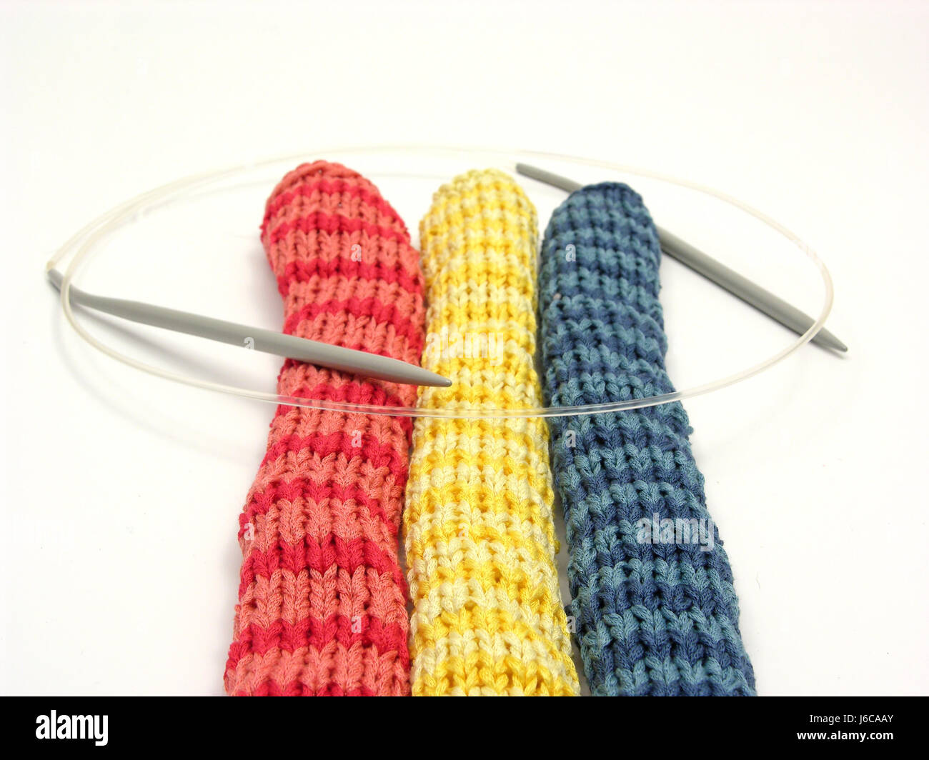 blue optional wool striated knit roll scarf handicraft yarn homemade knitting Stock Photo