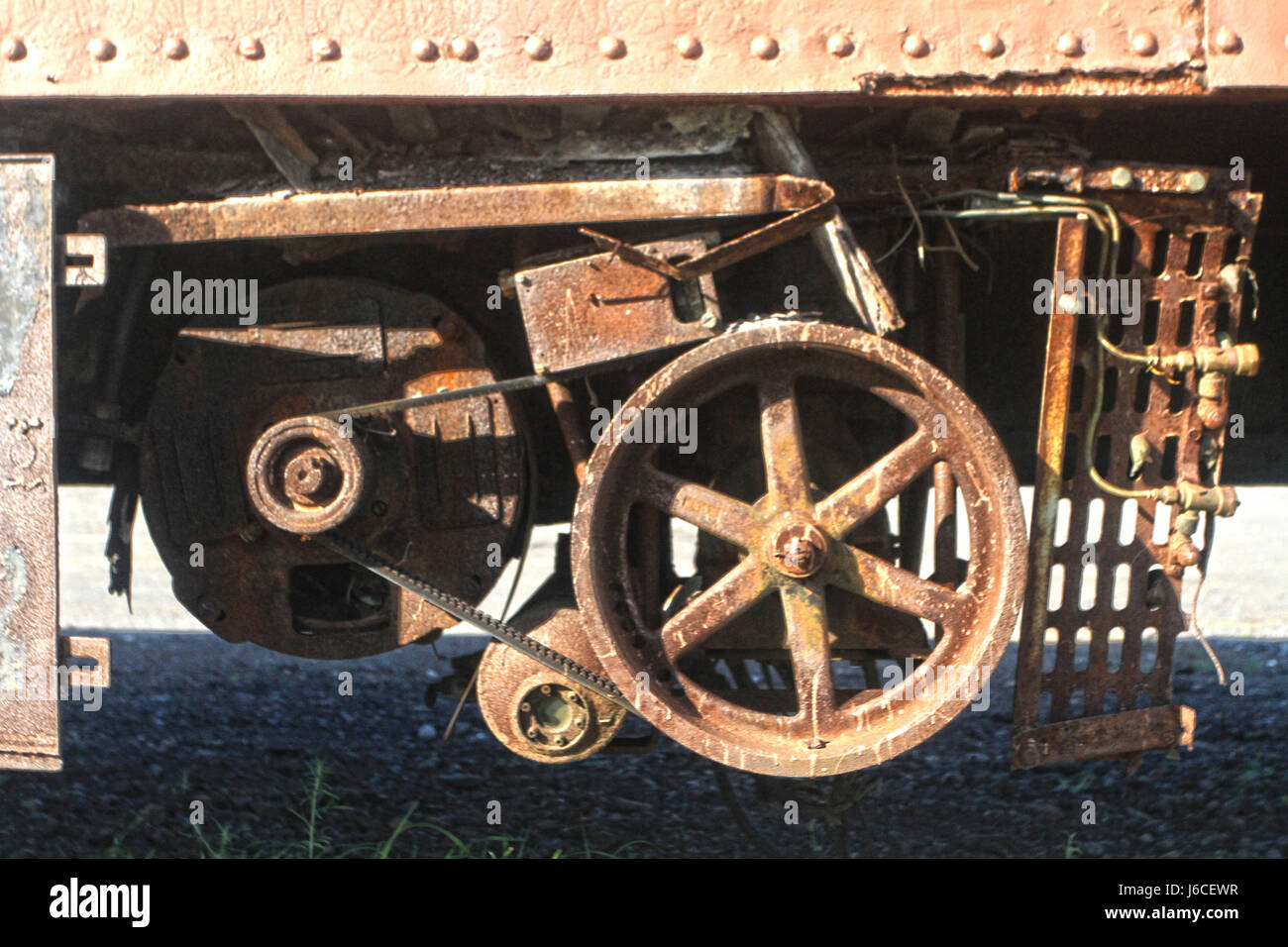 Detail of old machinery on the underside of an abandoned railway car. Stock Photo