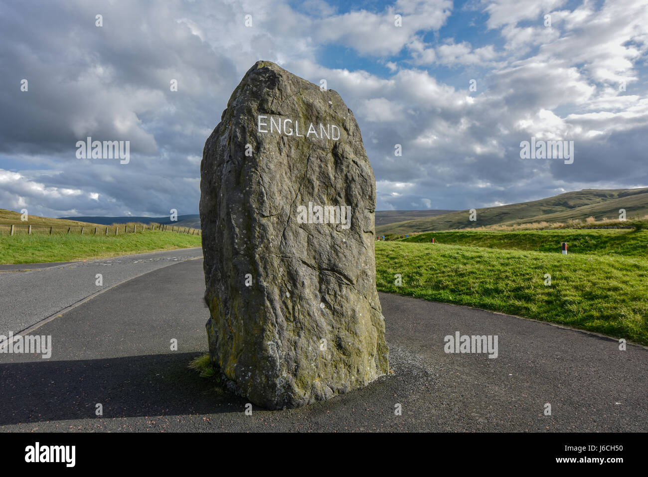Scottish border to England. Boundary stone on the road, Scotland, England, Europe Stock Photo