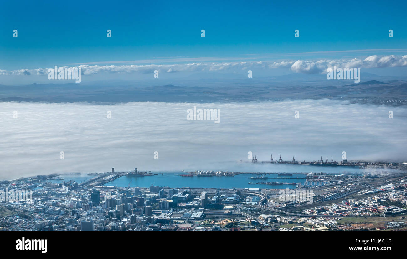 Sea fog covering dockyard harbour area of Cape Town, Western Cape, South Africa, view from Table Mountain Stock Photo
