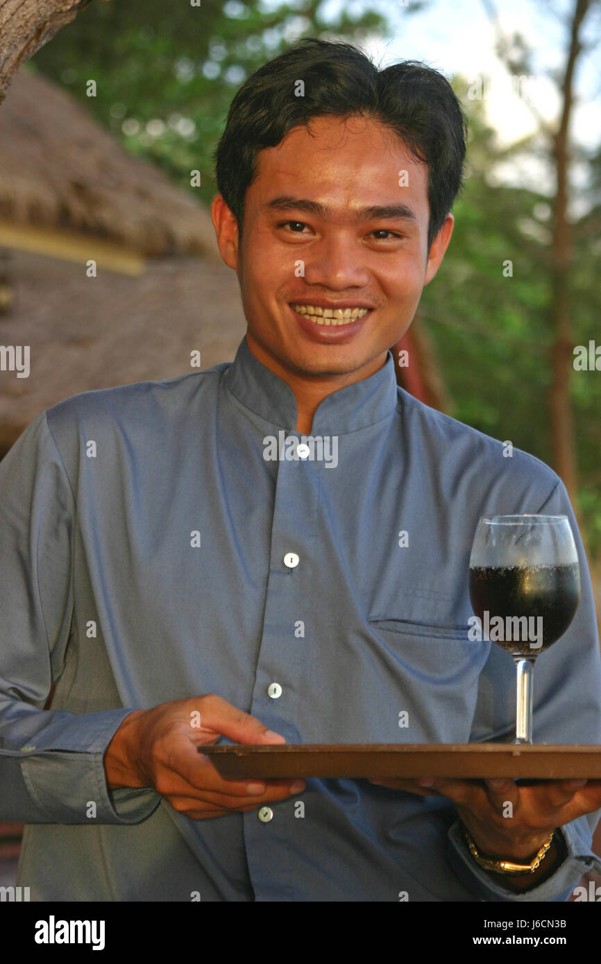 wine location shot waiter serve young younger man laugh laughs laughing twit Stock Photo
